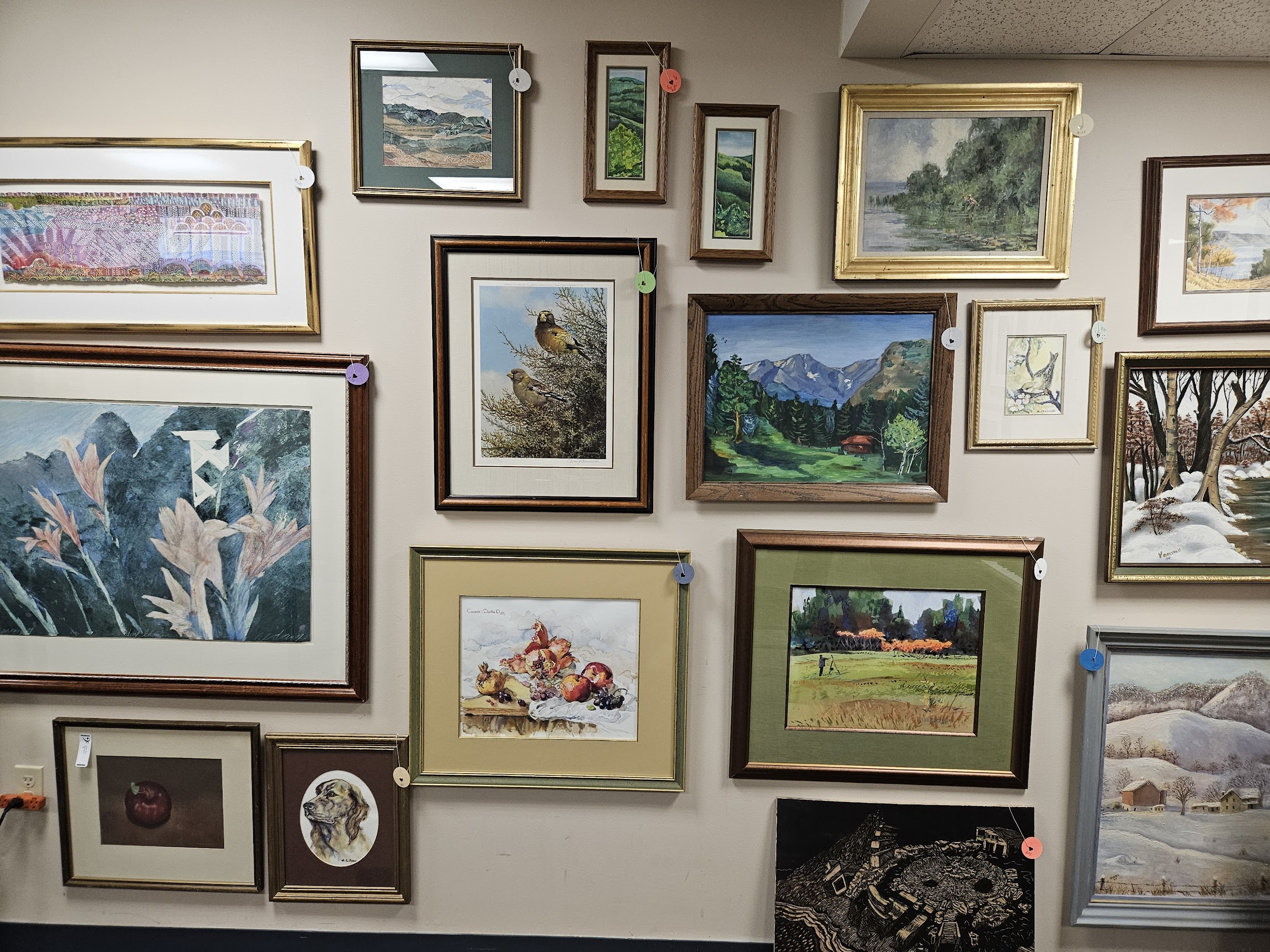 Musician sits in profile with guitar resting on lap.