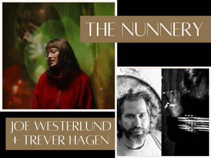 Musician sits in profile with guitar resting on lap.